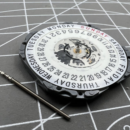 Hattori Epson TMI VJ55 quartz watch movement with date at 6, precision Japan-made component.