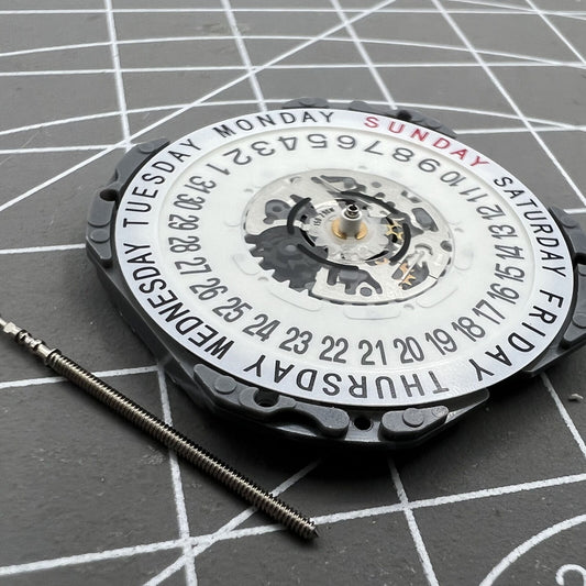 Hattori Epson TMI VJ55 quartz watch movement with date at 6, precision Japan-made component.