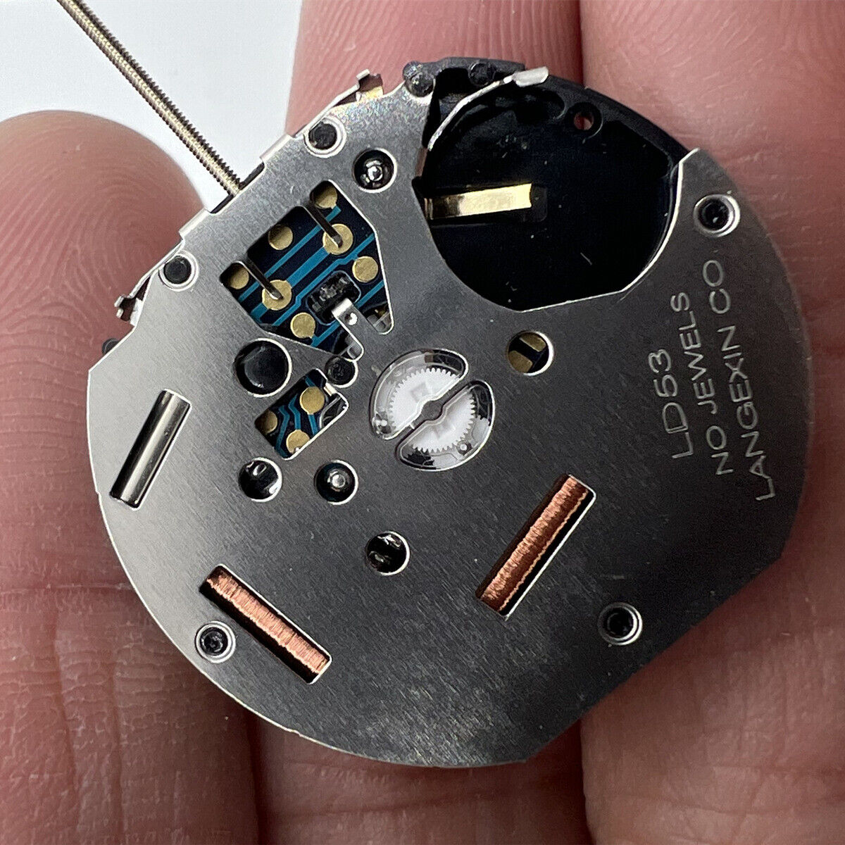 Close-up of LD53 small second quartz watch movement displaying three hands at 3, 6, and 9 o?clock positions, perfect for precise timekeeping.