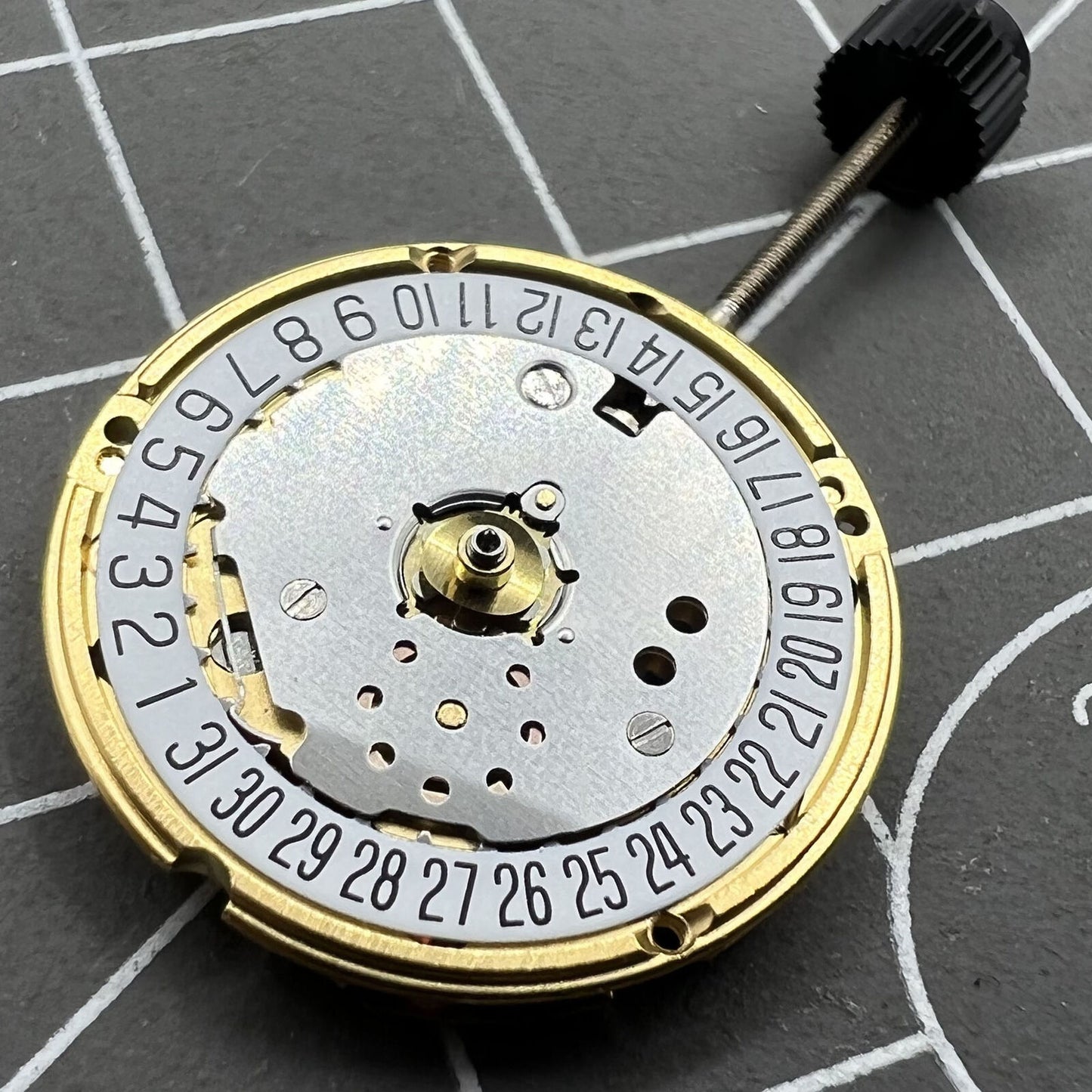 ETA F03.115 watch quartz movement with 3 hands and date at 6, precise Swiss craftsmanship.