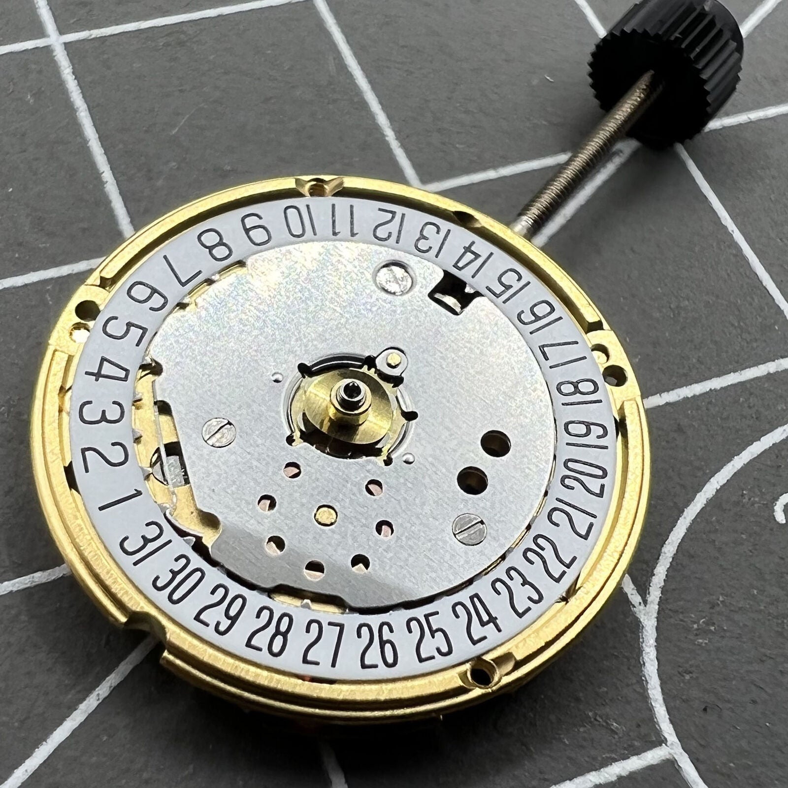 ETA F03.115 watch quartz movement with 3 hands and date at 6, precise Swiss craftsmanship.