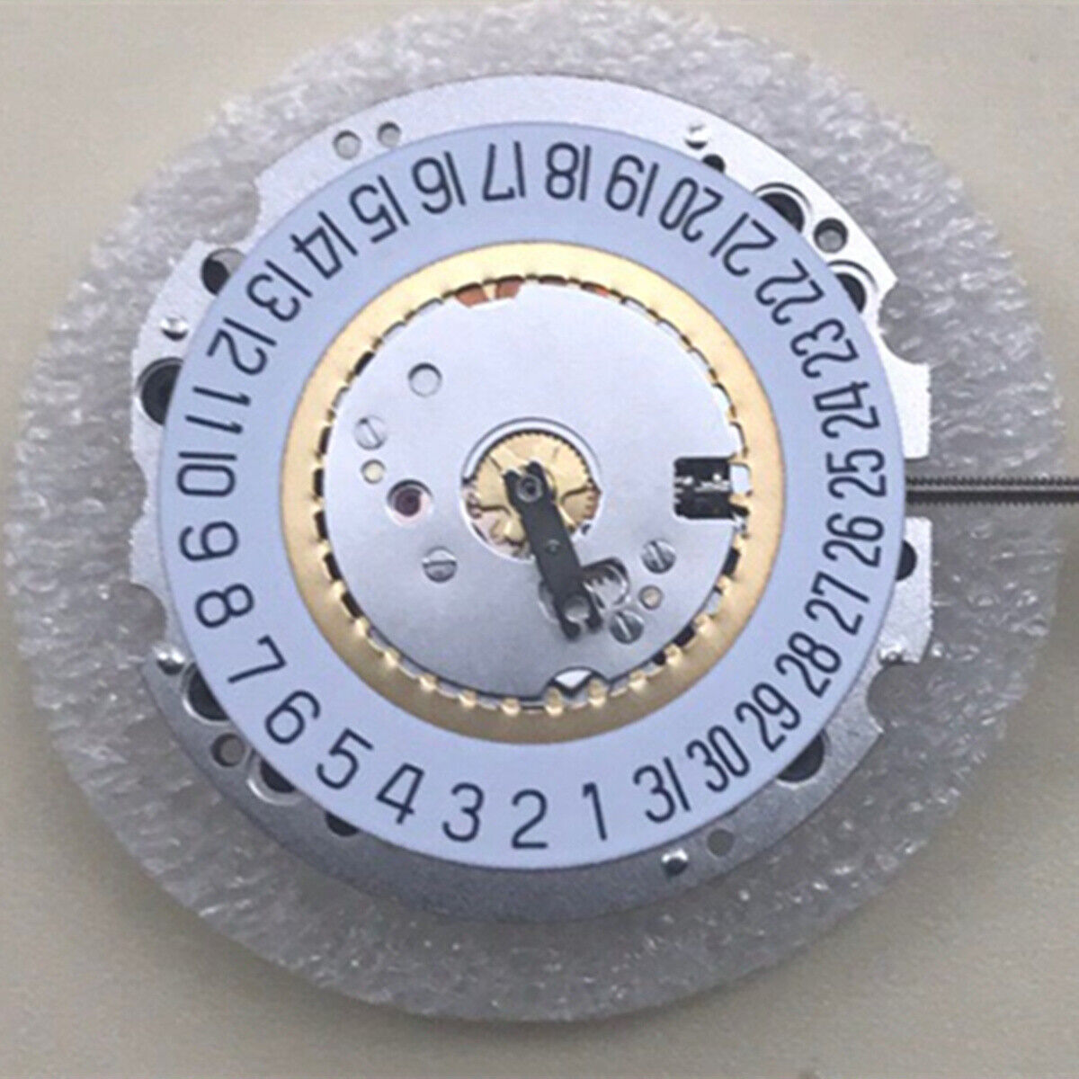 Swiss Ronda 705 quartz movement watch part with 3 hands and date at 6, for precise timekeeping.