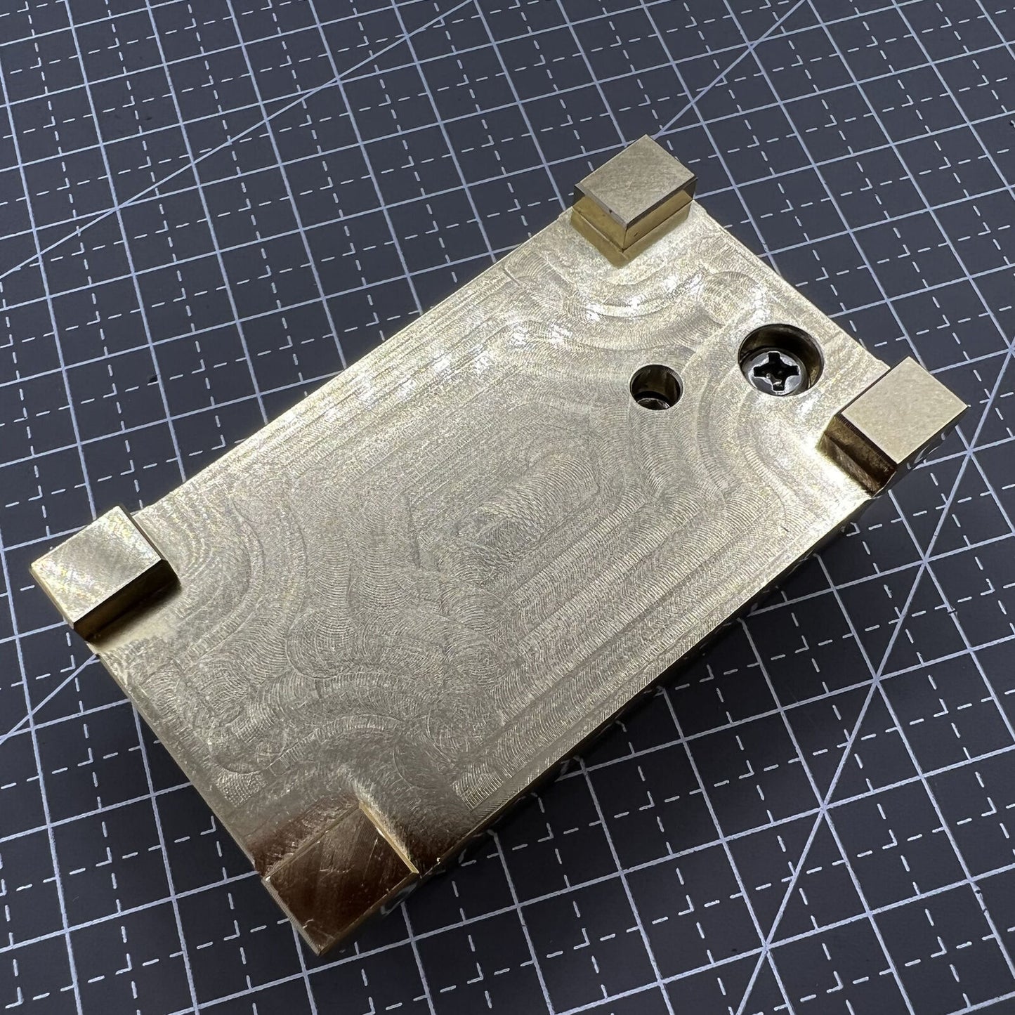 Brass-handled stainless steel pegwood tool by Woodcutter for precise watch cleaning and detailing.