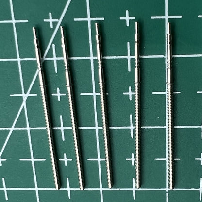 Wholesale lot of replacement watch winding stems compatible with PE90 movement, durable watch repair parts.