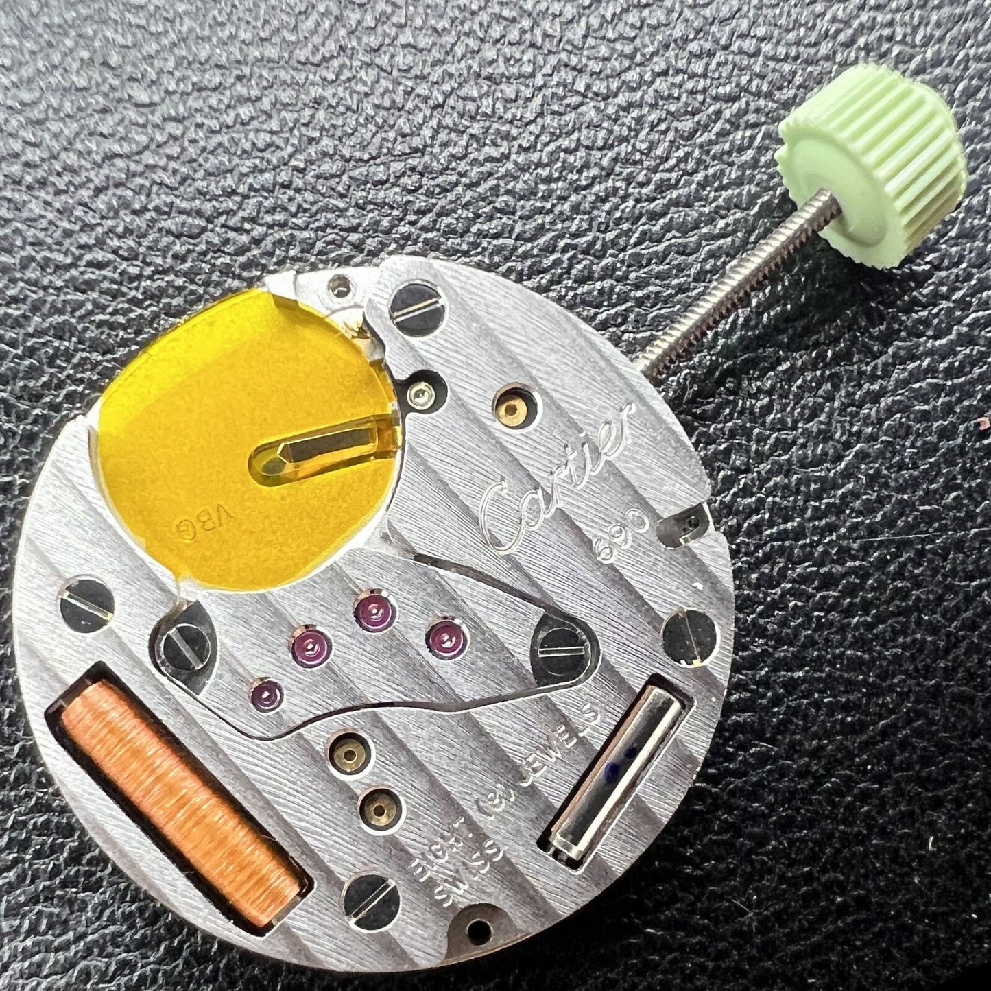 Cartier CTR-690 Swiss Made quartz watch with classic 2-hand display, elegant black leather strap.