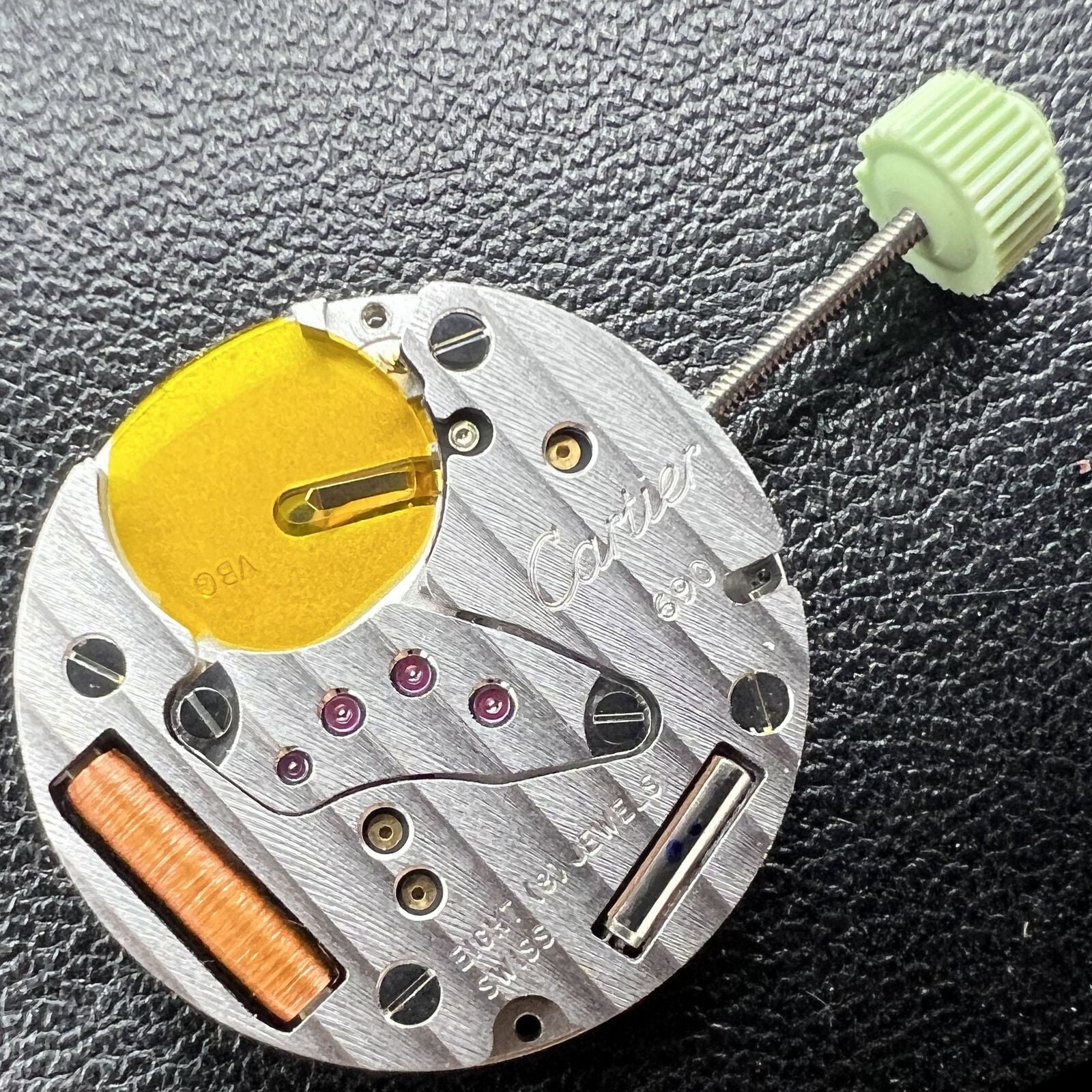 Cartier CTR-690 Swiss Made quartz watch with classic 2-hand display, elegant black leather strap.