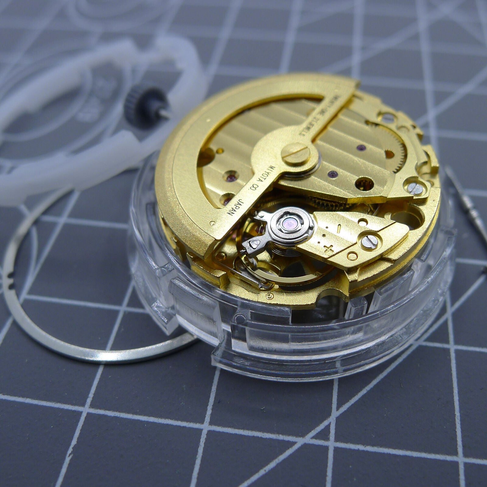 Gold-tone Miyota 82S0 mechanical watch movement displaying automatic precision engineering.