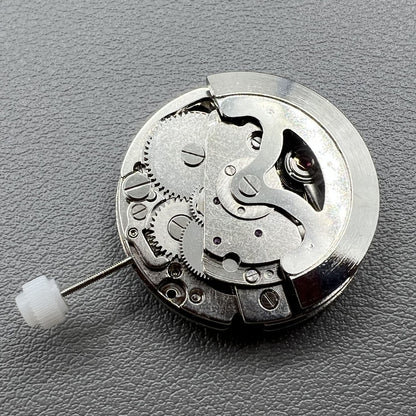 7120 Hollow silver automatic watch movement displaying intricate mechanical gears for precise timekeeping.