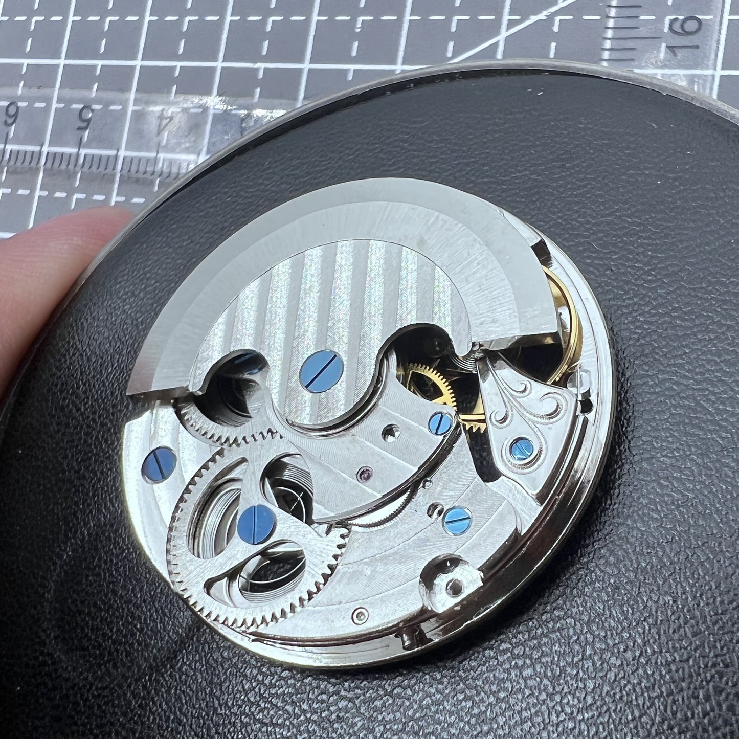 Small silver hollow watch movement with double mainspring and balance wheel at 6 o?clock by Kleines brand.
