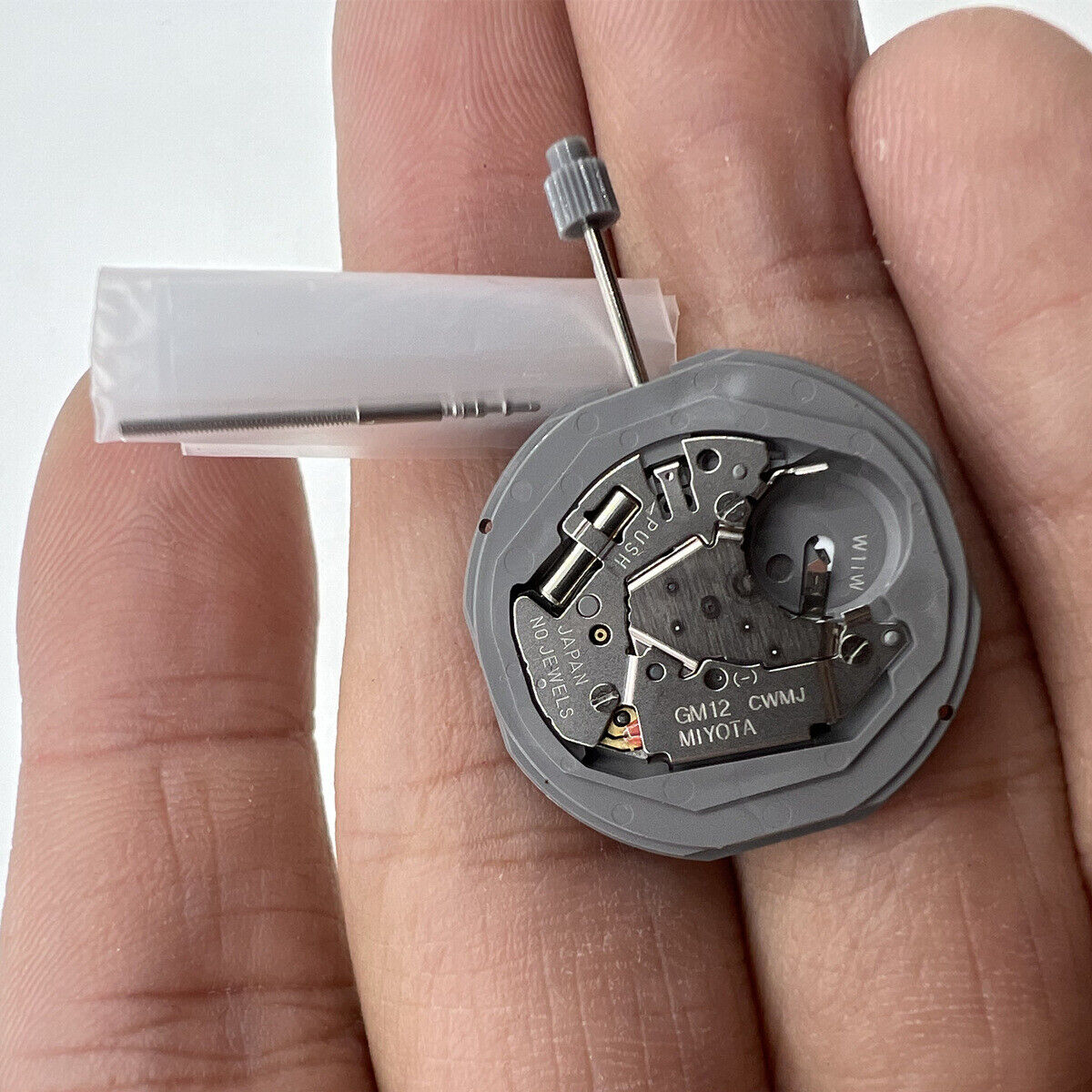 Miyota GM12 Japan quartz watch movement with date display at 3 o'clock for precise timekeeping.