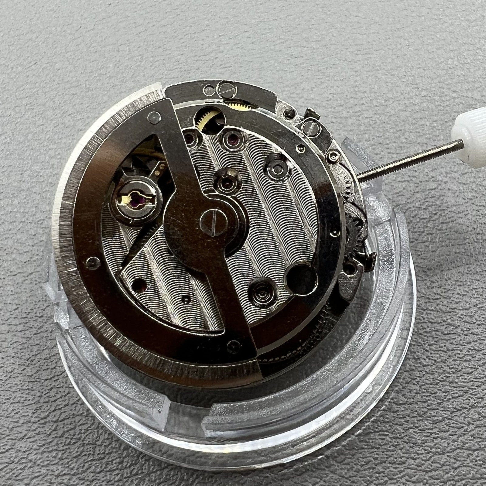 China Made 8205 automatic mechanical watch movement featuring small seconds at 3, 6, and 9 o'clock for precise timekeeping.