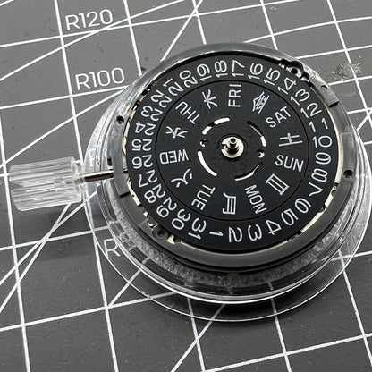 Miyota NH36A automatic movement with black finish and blue lume, showing crown at 3/3.8 position for precise timekeeping.