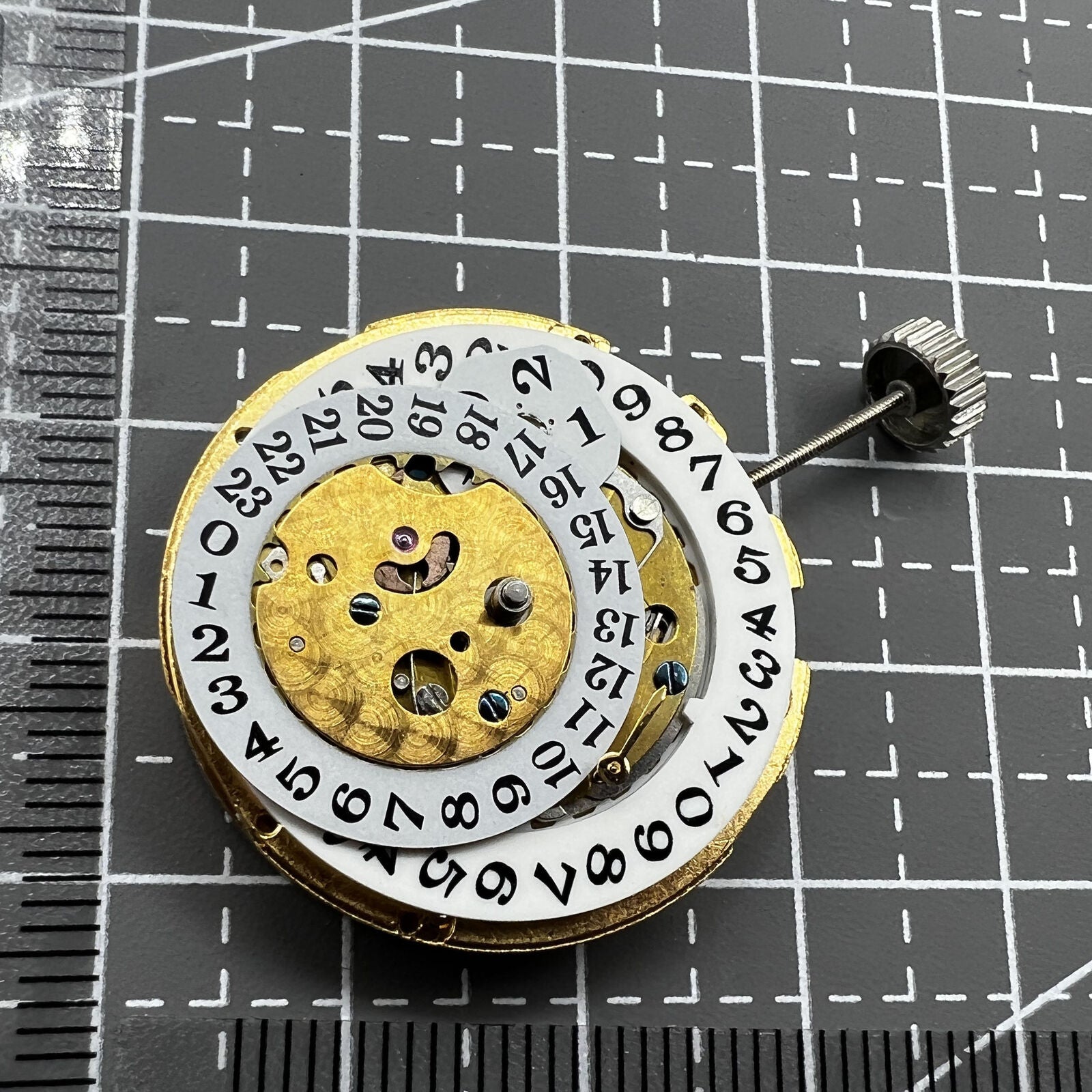 Multifunctional automatic watch with mechanical movement, date at 2 o'clock, and 24-hour digital dial.