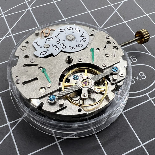 Automatic mechanical watch with reversed balance wheel, big date at 12, precision timekeeping.
