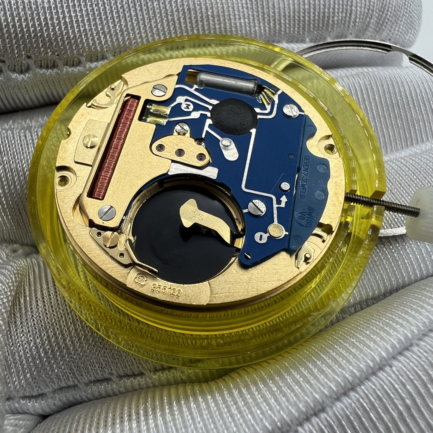 Swiss Made ETA 955.122 quartz movement with double calendar and three hands for precise watch functionality.