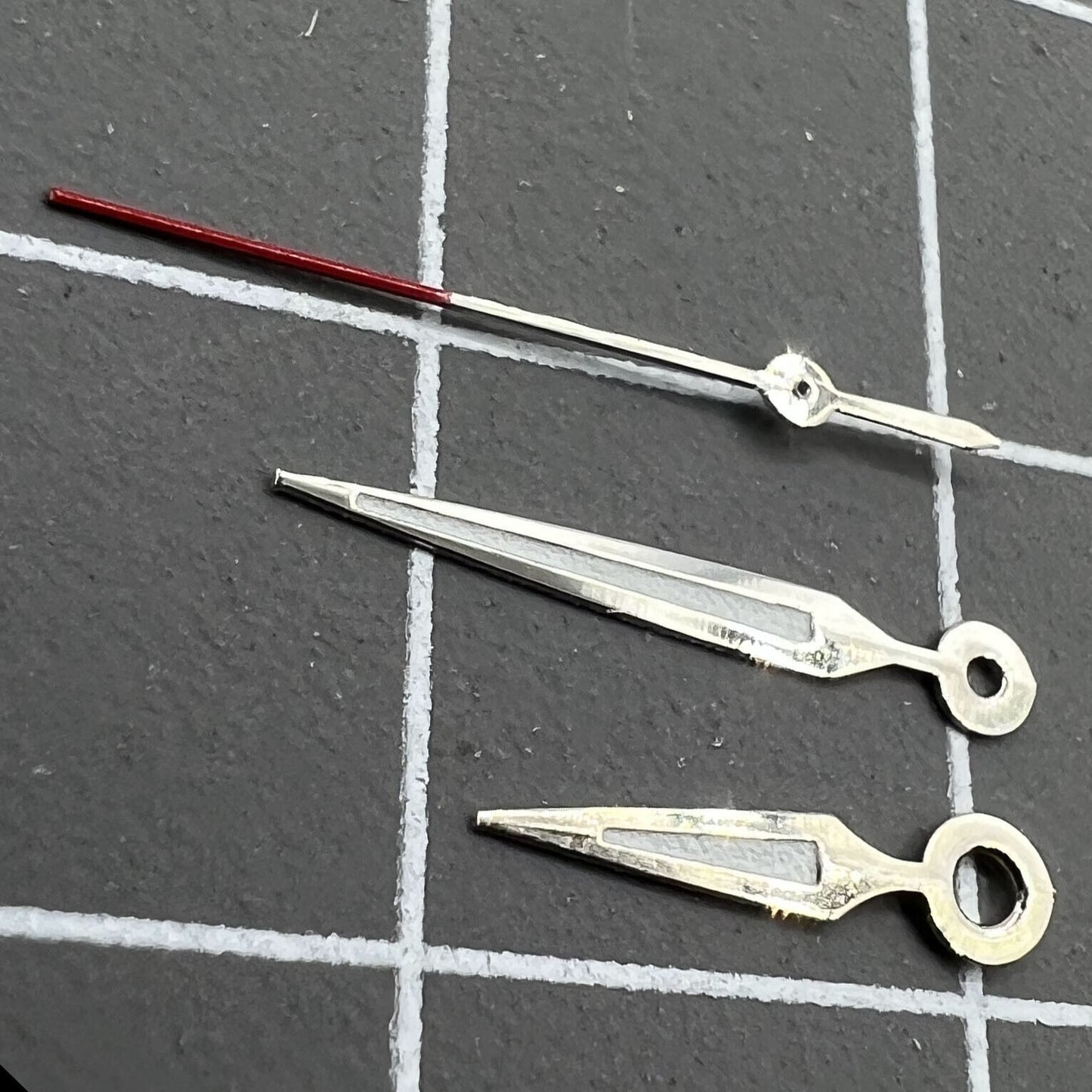 Luminous arrow-shaped watch hands, compatible with Miyota 2035 quartz for enhanced visibility.