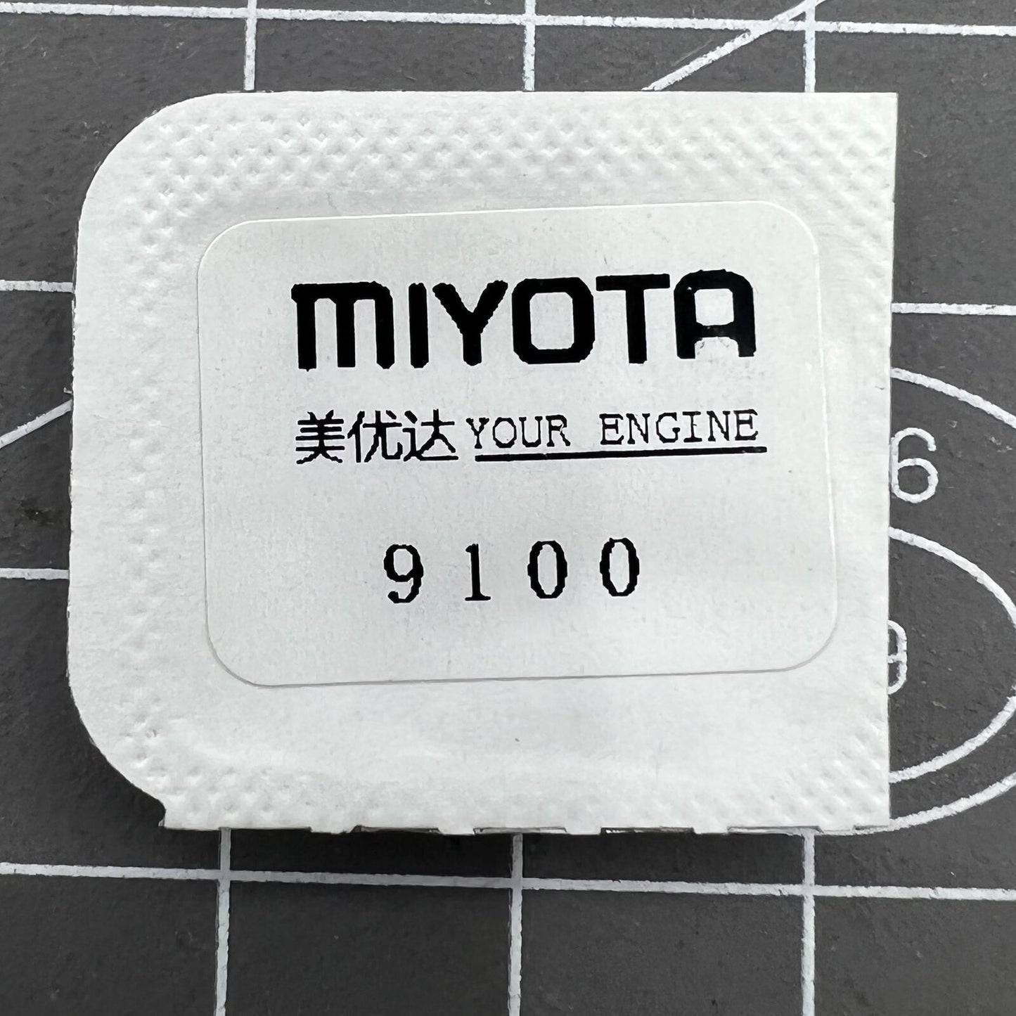 Complete barrel with mainspring for Miyota 9100 watch movement, durable generic replacement part for repairs.