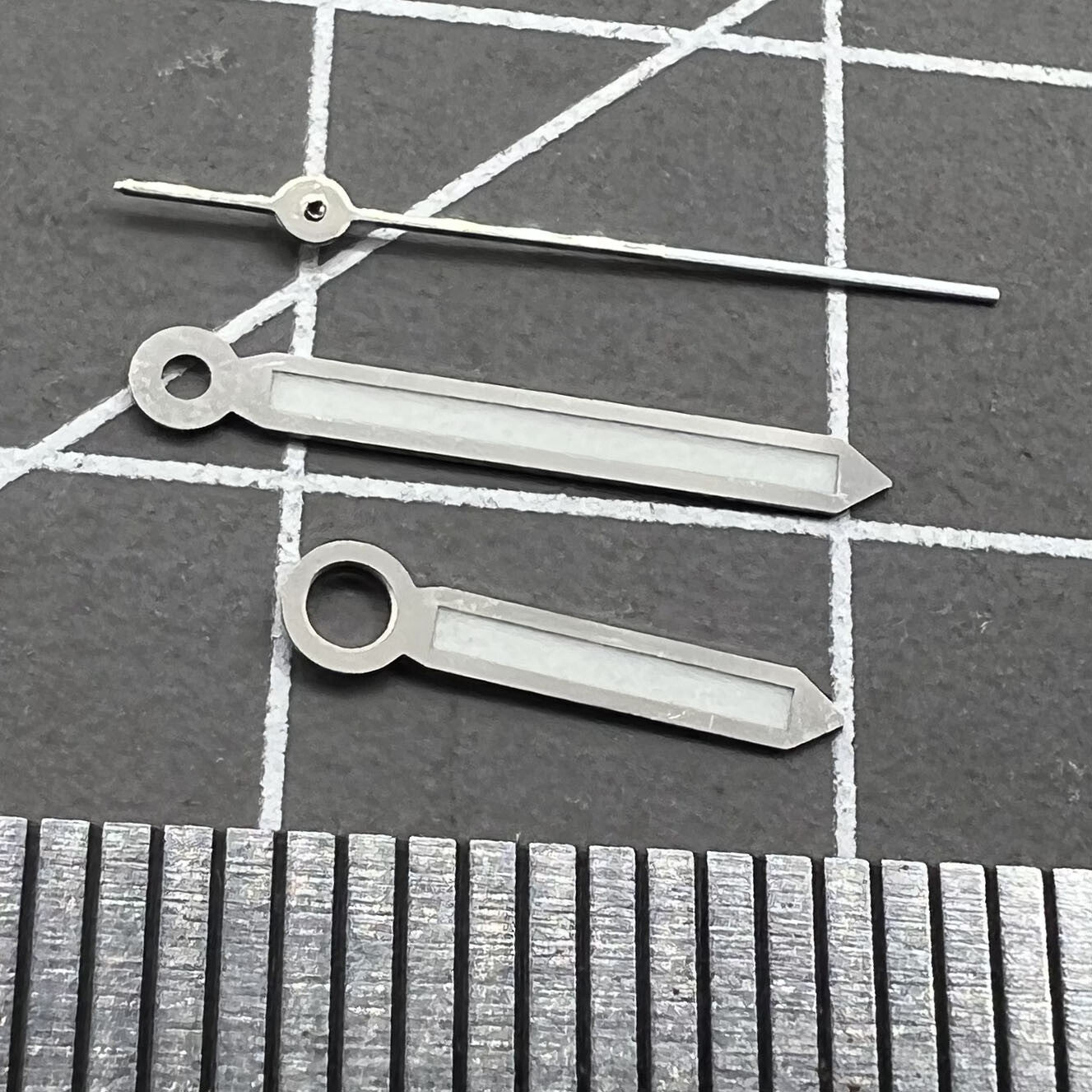 Set of 2 green luminous 17mm watch hands with silver trim for Miyota 2035, 2115, 2105, 2305 movements.