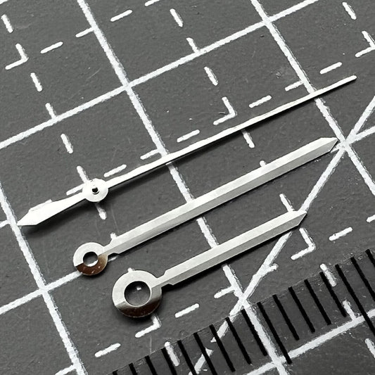 Silver watch hands set for ETAC07.111 movement, compatible with T099 watch, precision design.