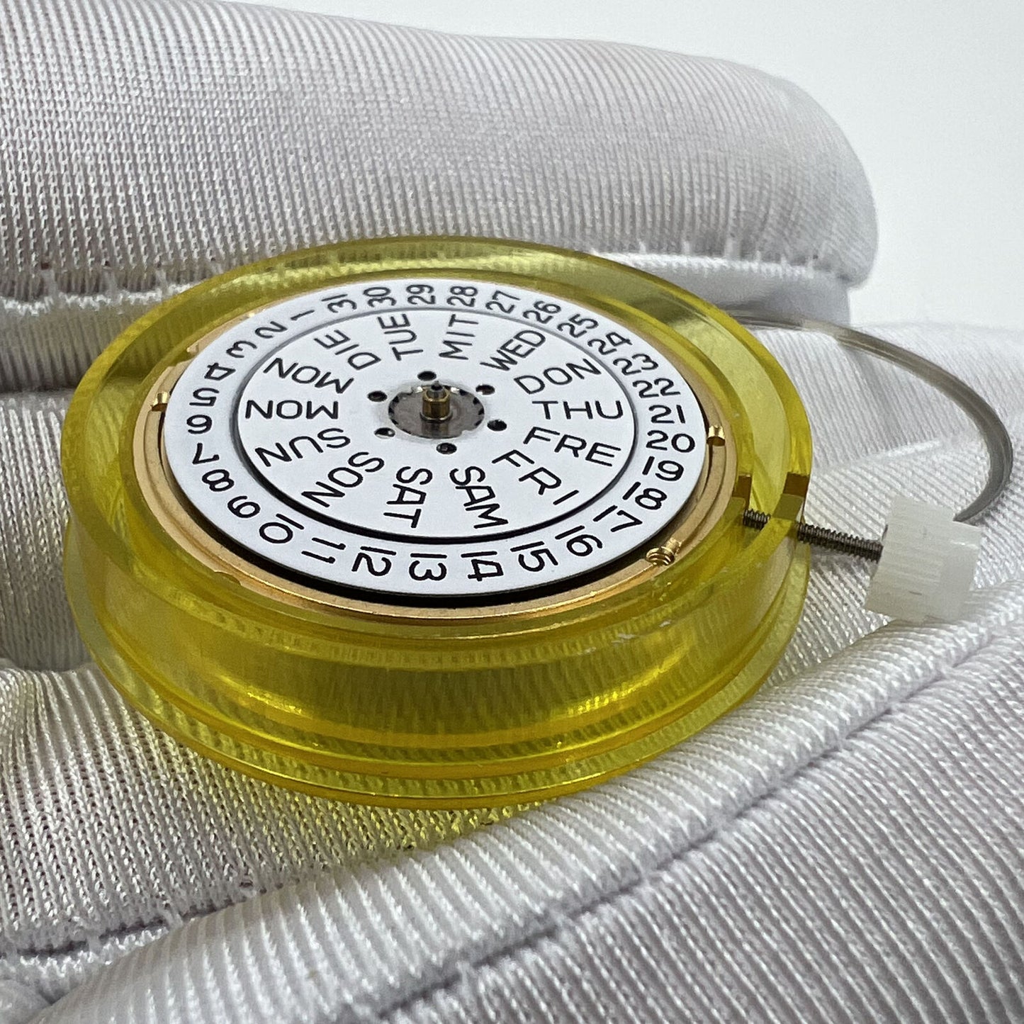 Swiss Made ETA 955.122 quartz watch movement with double calendar and three hands for precise timekeeping.