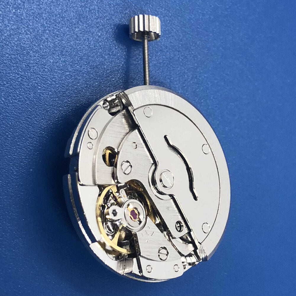 Tian Jing DG2813 automatic watch with silver dial, mechanical movement, and day-date display.