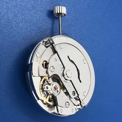 Tian Jing DG2813 automatic watch with silver dial, mechanical movement, and day-date display.