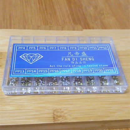 Assorted 18-size imitation diamond watch repair patches, pointed bottom for precise watch bezel repairs.