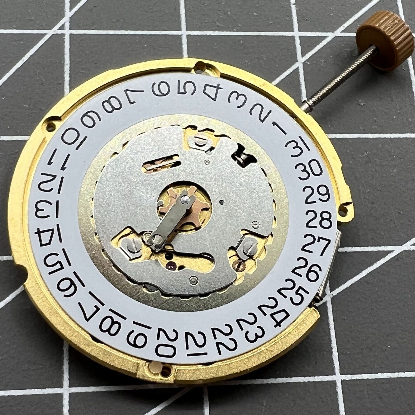 Swiss Made Ronda 6004D quartz watch movement with date window at 3 o?clock, precise timing accessory.