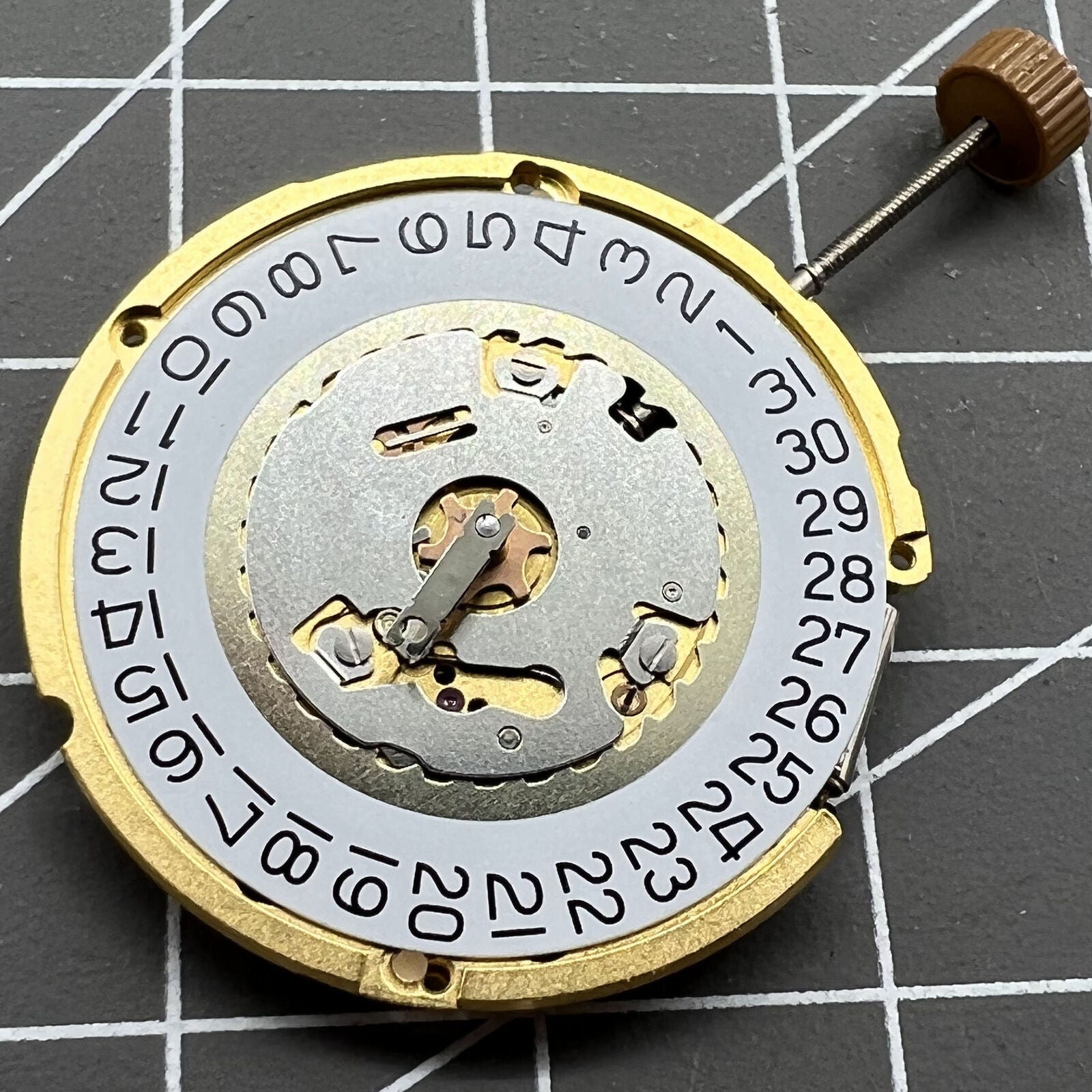 Swiss Made Ronda 6004D quartz watch movement with date window at 3 o?clock, precise timing accessory.