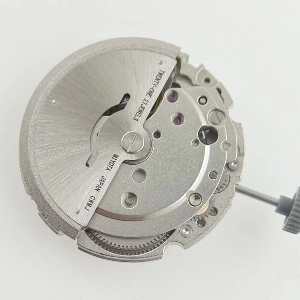 Miyota/Citizen 8215 watch movement with black dial, date at 6, automatic mechanical precision, Japan-made.