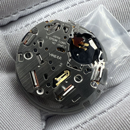 Hattori Epson TMI YM64A quartz watch movement, Japan-made mechanism for accurate timekeeping.