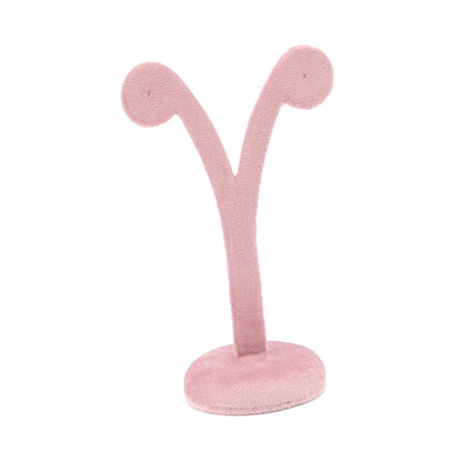 Earring display stand with hanging hooks showcasing organized jewelry for stylish storage.