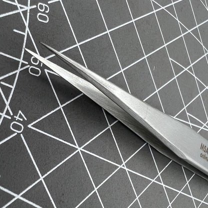 Swiss Horotec MSA12.302-3 antimagnetic fine tweezers for precise hairspring handling in watch repairs.