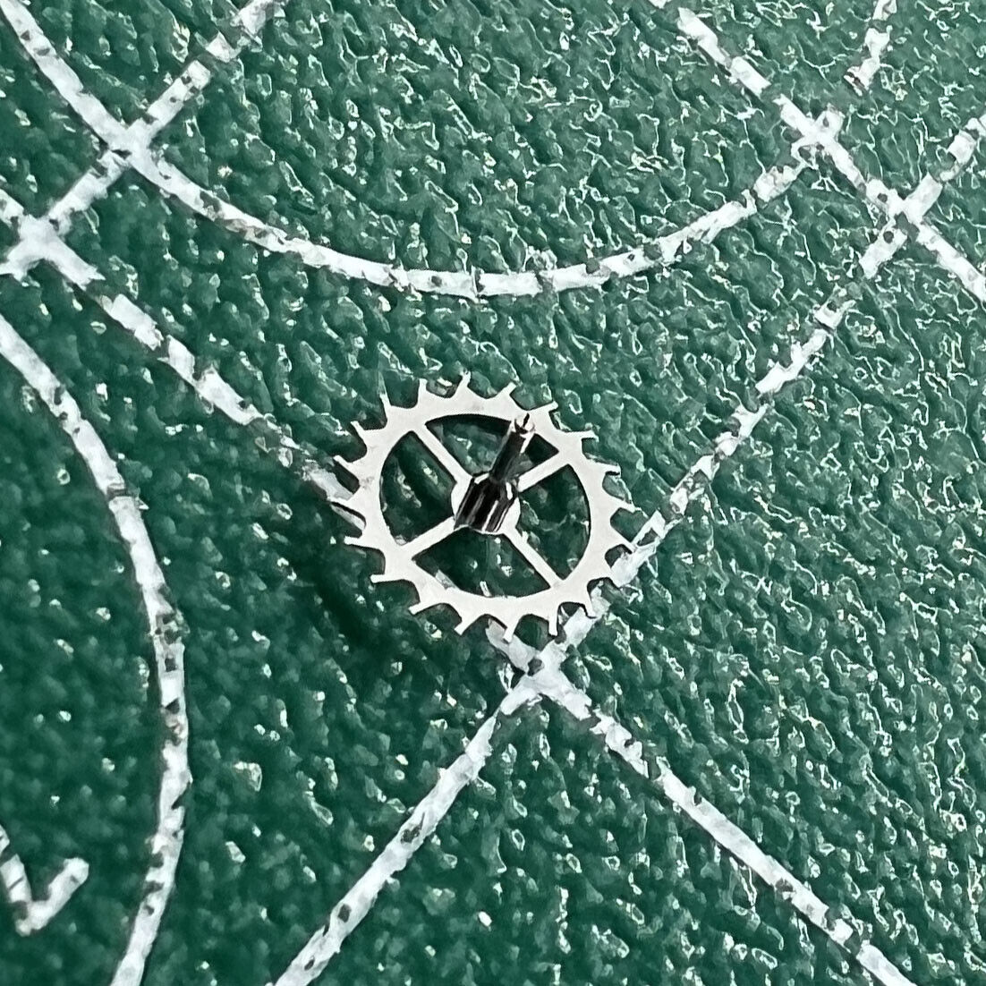 Escape wheel for Dandong 7750 watch movement, precision repair part ensuring accurate timekeeping.