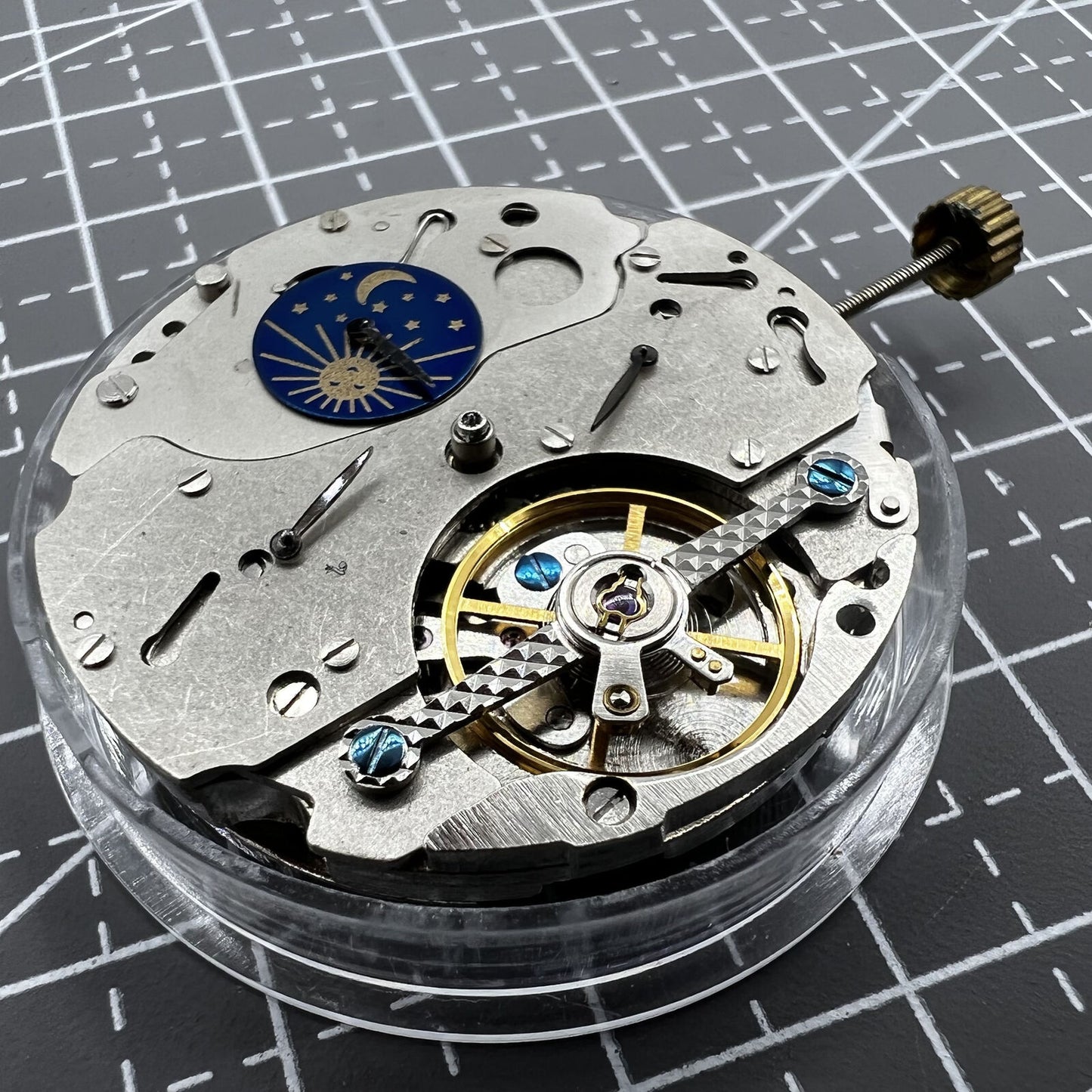 Multifunctional automatic watch with mechanical movement and moon phase at 12 o'clock.