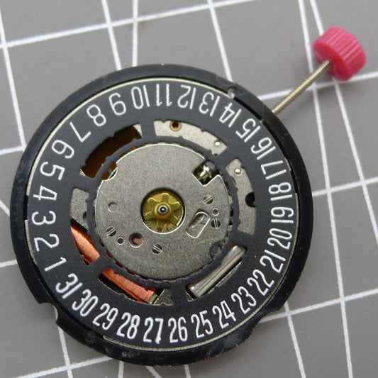 Swiss Ronda 715 Quartz watch movement with black date wheel, date display at 6 o'clock, precision timekeeping.