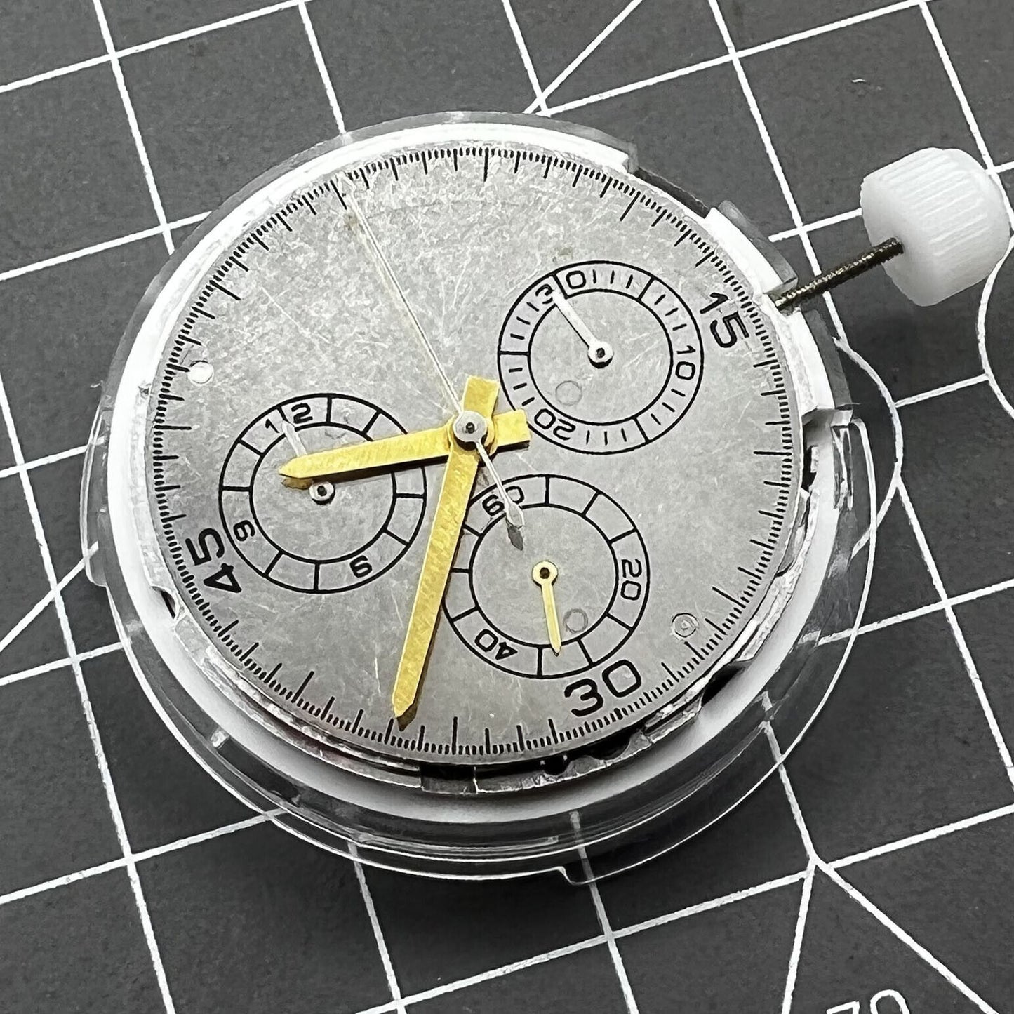 Chinese 4130 automatic watch movement with multifunctional small seconds at 3, 6, and 9 o'clock positions.