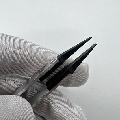 Swiss Made Horotec MSA12.711 carbon fibre tweezers with broad flat tips for precise watch repair handling.