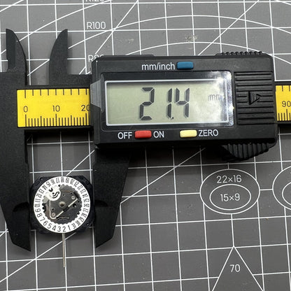 Seiko VX22 quartz watch movement with white date disks at 3 and 6 o'clock, Japan made.