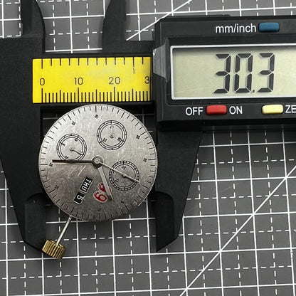 7750 chronograph watch with black dial, three hands, small second at 9 o'clock, day date display