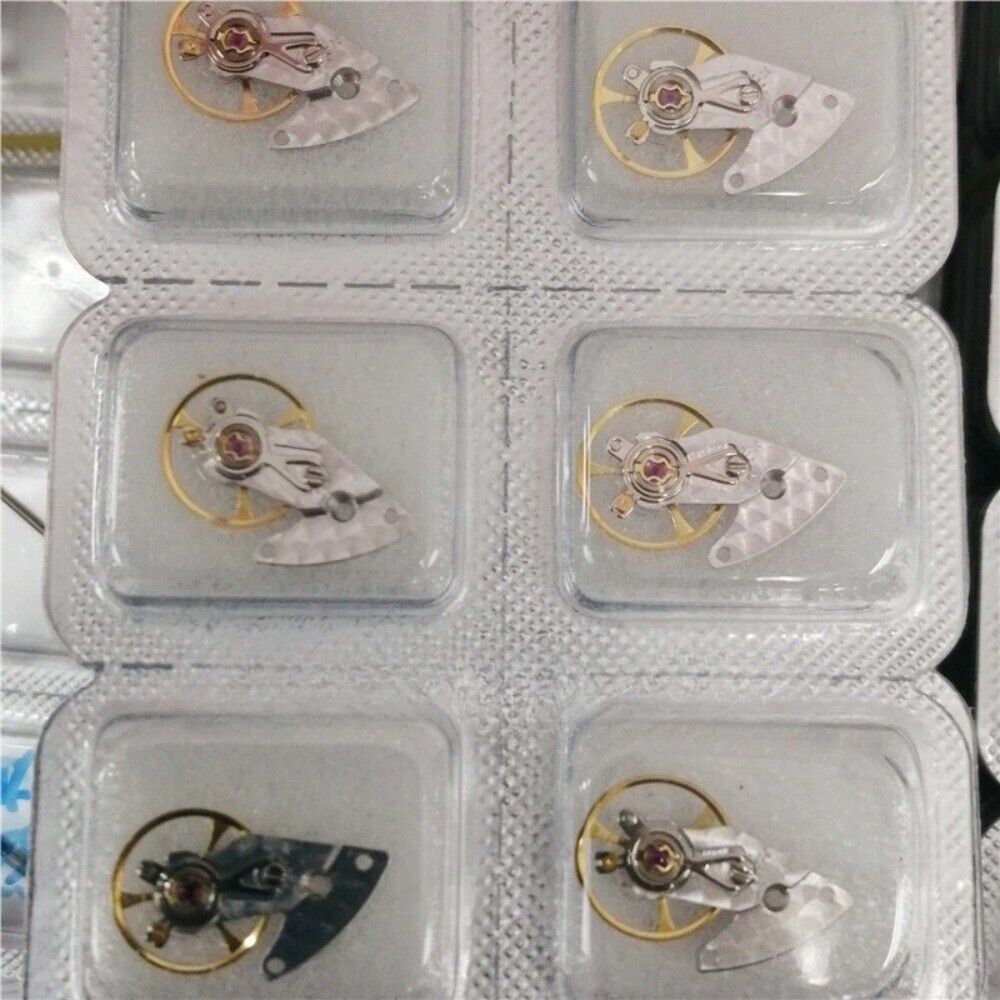 Silver carved watch balance wheel with splint for ETA2892 movement, precision China-made component for watch repair.