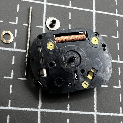 Hattori VX01 quartz watch movement with three hands, precision timekeeping for watch repair.