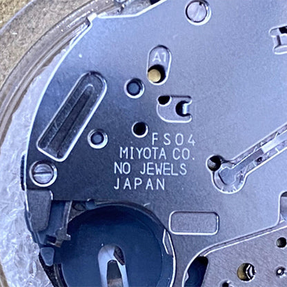 Miyota FS04 quartz watch movement showing multifunction calendar and small second features for precise timekeeping.