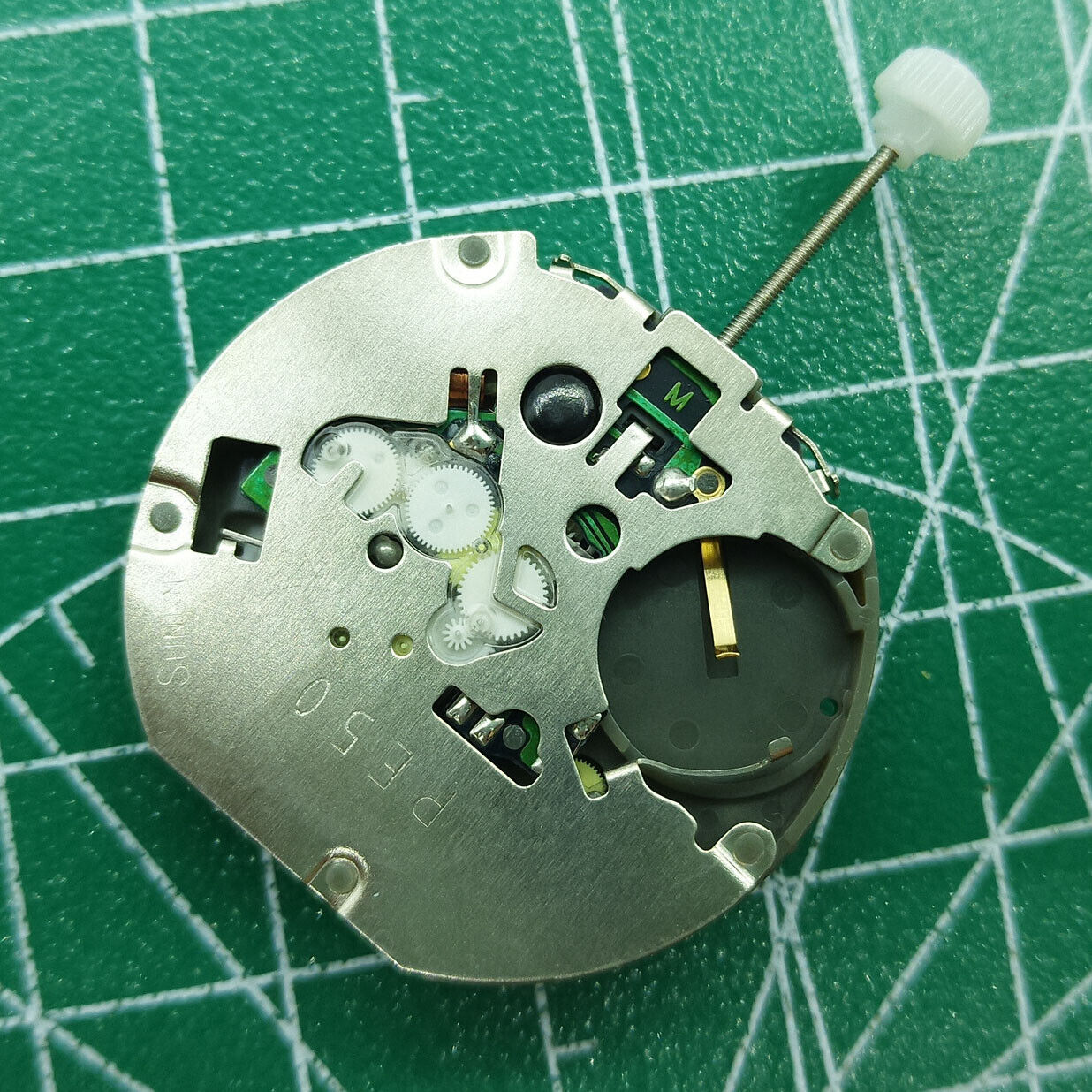 Sunon PE50 quartz watch movement featuring date at 3 and small seconds at 2, 6, 10 positions for precise timekeeping.