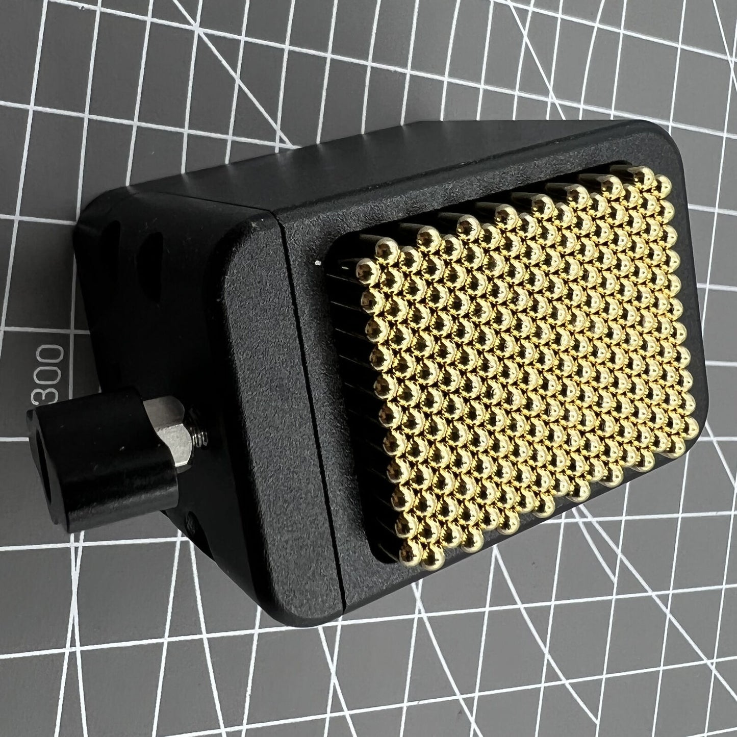 Universal China metal beads movement holder securing various watch movements during repair.