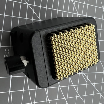 Universal China metal beads movement holder securing various watch movements during repair.