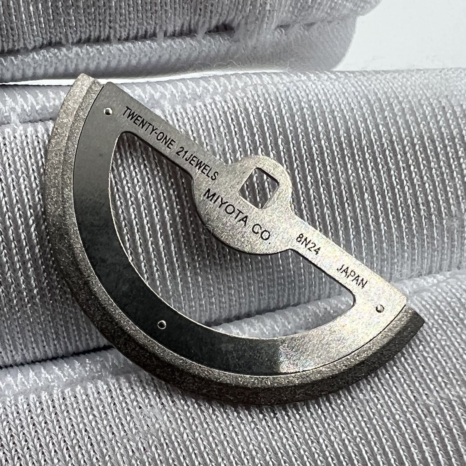 Silver rotor oscillating weight for 8N24 movement, generic fit watch part enhancing automatic winding.