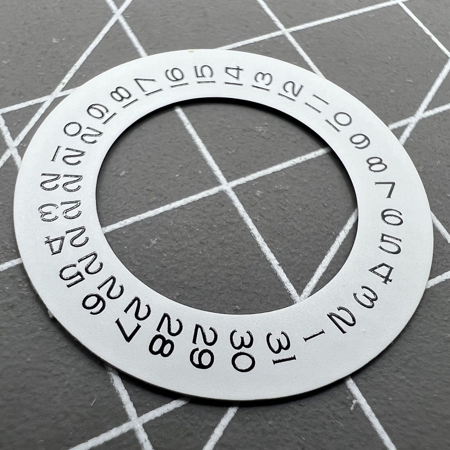 Thickening white date wheel overlay for ETA2824 movement with date window at 3 o'clock.