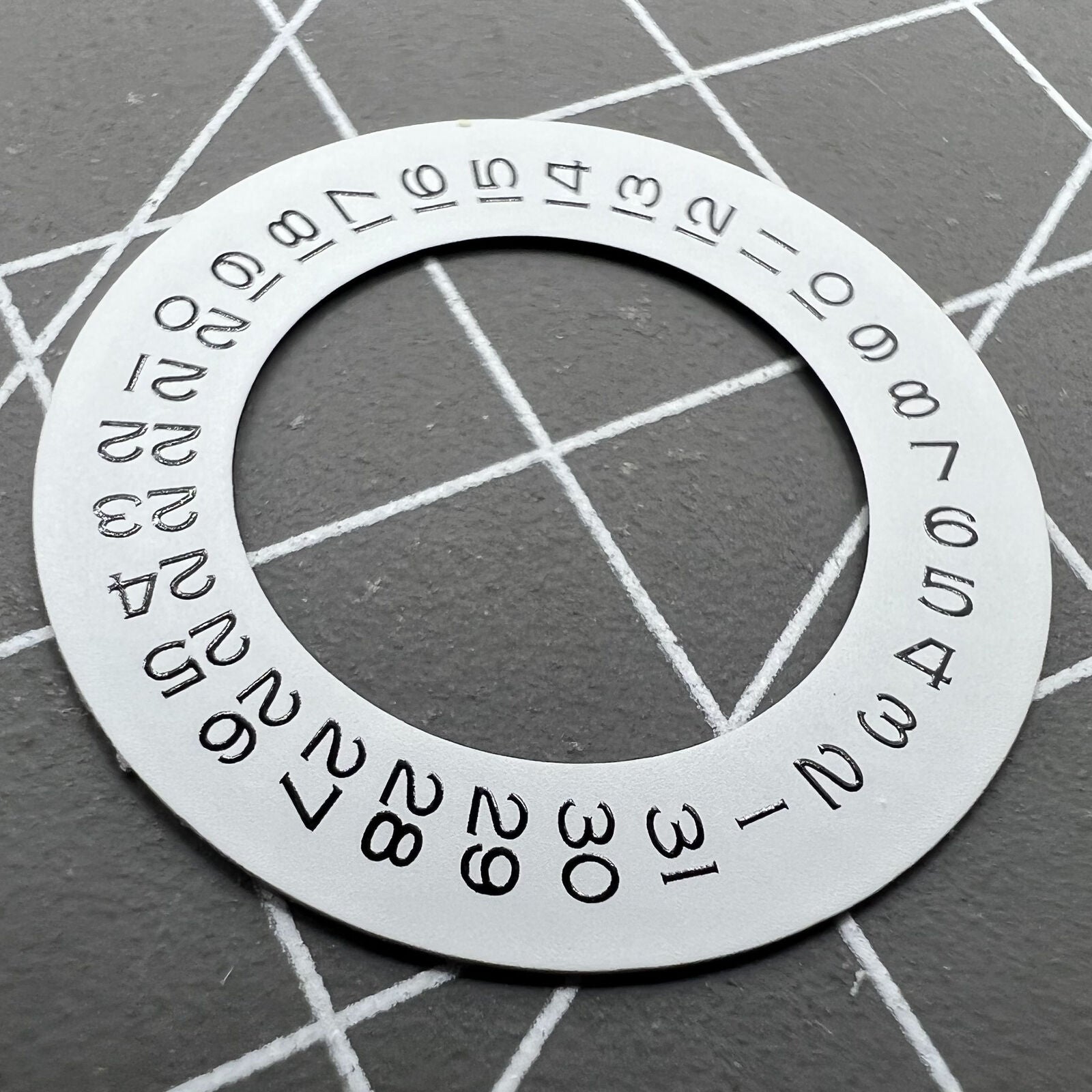 Thickening white date wheel overlay for ETA2824 movement with date window at 3 o'clock.