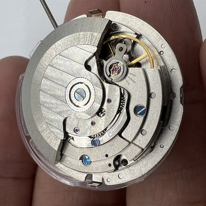 China Made Mechanical Automatic watch with 3 hands, big date at 12, and multi-function dial features.